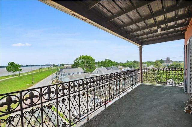 balcony featuring a water view