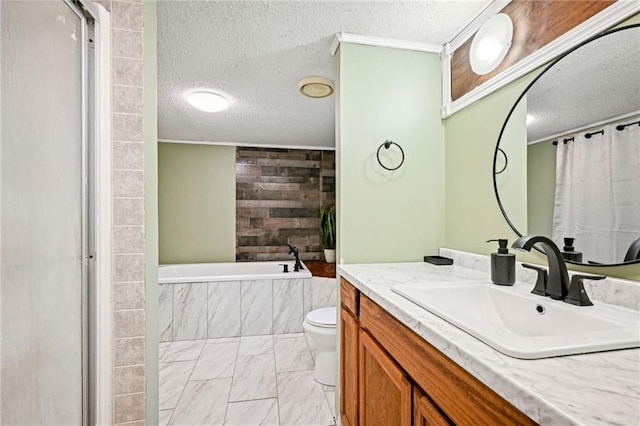 bathroom featuring wood walls, vanity, a textured ceiling, and toilet