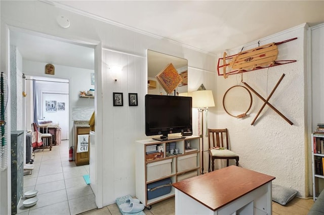 interior space featuring light tile patterned flooring and crown molding