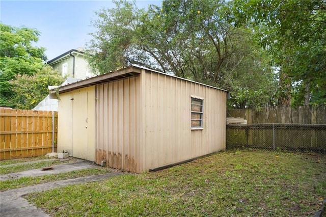 view of shed featuring a fenced backyard