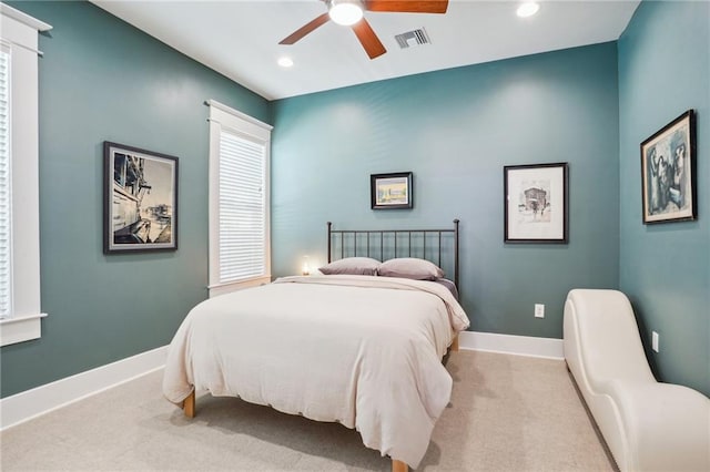 carpeted bedroom with ceiling fan