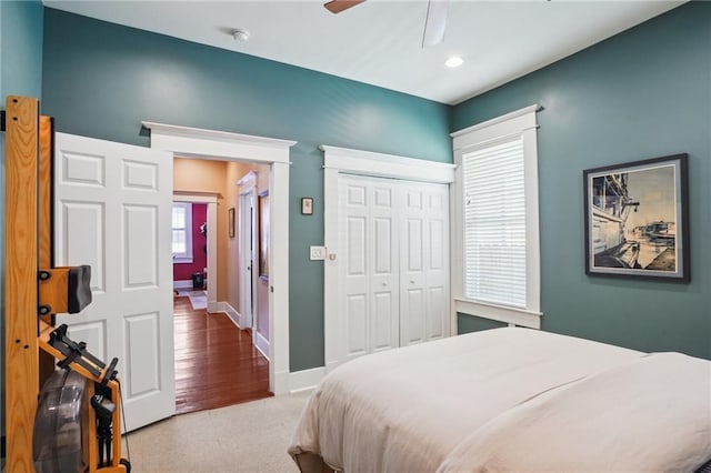 bedroom with ceiling fan and a closet