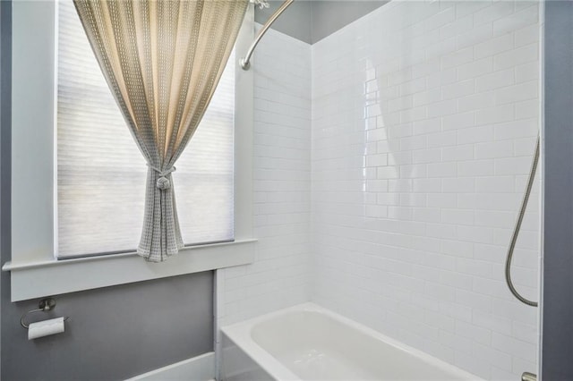 bathroom with shower / tub combination