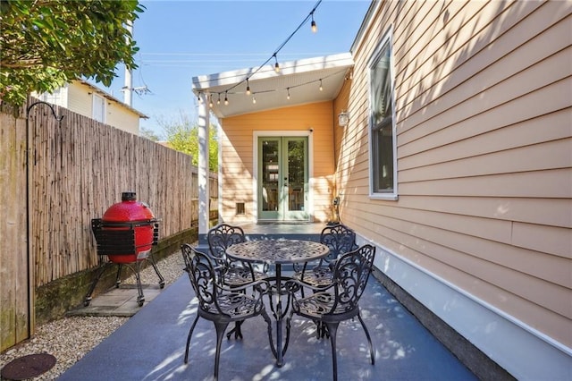 view of patio / terrace with french doors and a grill