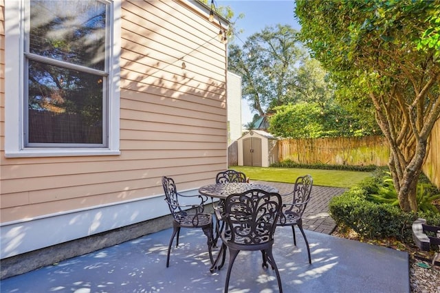 view of patio with a storage unit