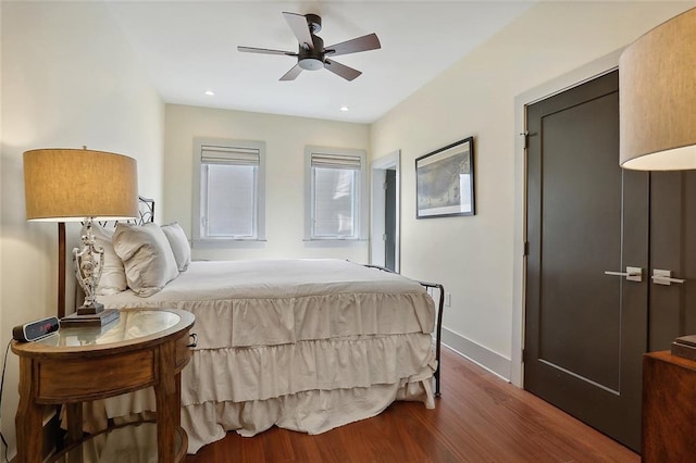 bedroom featuring ceiling fan and wood-type flooring