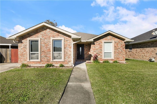 ranch-style house with a front yard