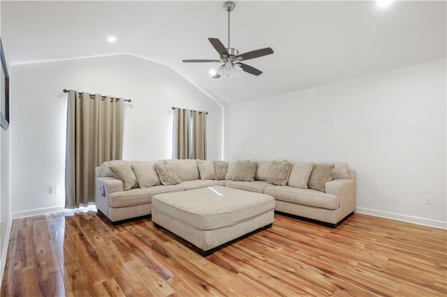 living room featuring light wood-type flooring, ceiling fan, and lofted ceiling