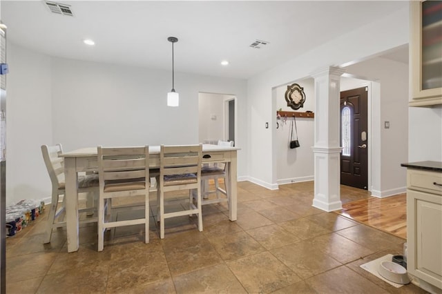 dining space with decorative columns