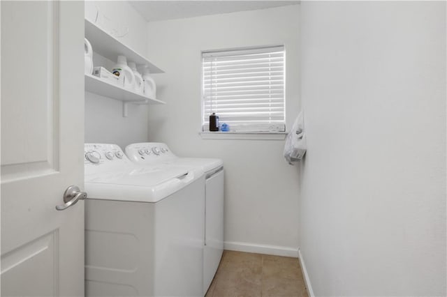 clothes washing area featuring independent washer and dryer and light tile patterned flooring