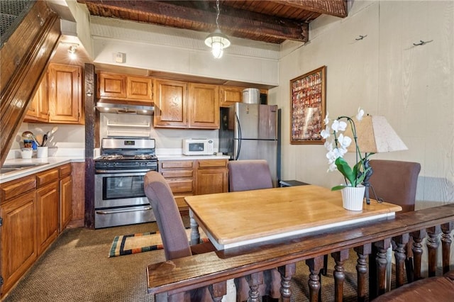 kitchen featuring carpet flooring, sink, wooden ceiling, beamed ceiling, and appliances with stainless steel finishes