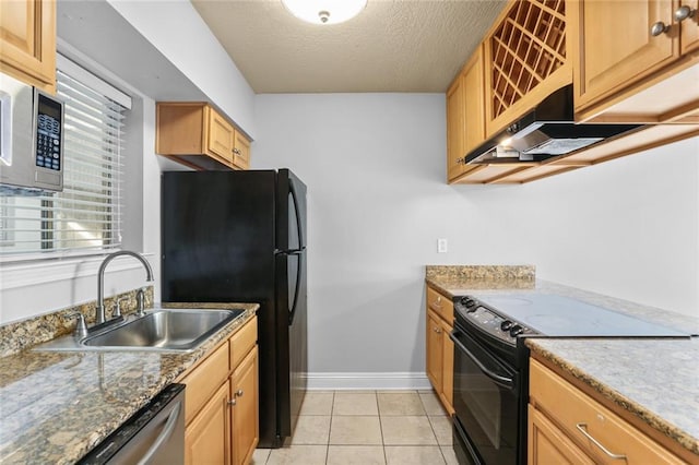 kitchen with sink, light stone counters, a textured ceiling, light tile patterned floors, and black appliances