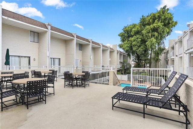 view of patio / terrace featuring a community pool