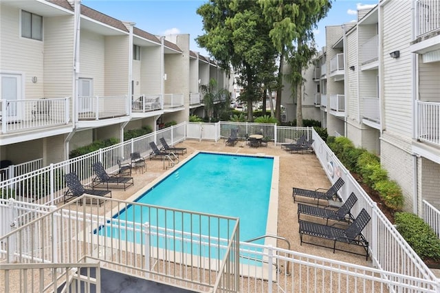 view of swimming pool featuring a patio area