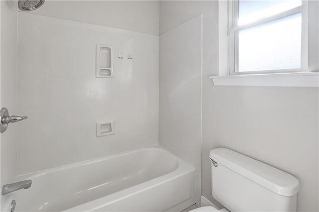 bathroom with shower / bathtub combination and toilet