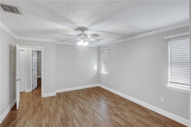 spare room with a textured ceiling, ceiling fan, light hardwood / wood-style floors, and crown molding