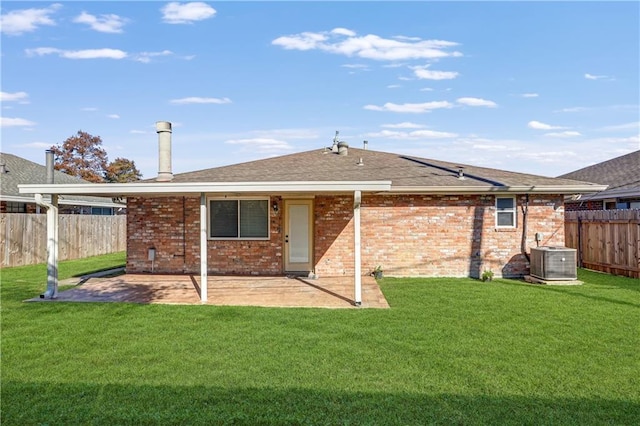 back of property featuring a patio, cooling unit, and a lawn