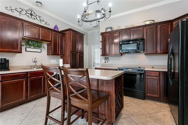 kitchen featuring sink, light tile patterned floors, black appliances, and an inviting chandelier