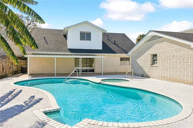 view of pool with an in ground hot tub, central AC, and a patio area