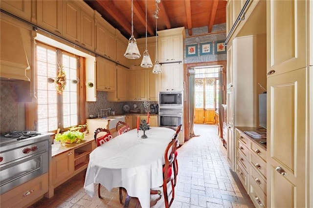 kitchen with decorative light fixtures, oven, wooden ceiling, beam ceiling, and built in microwave