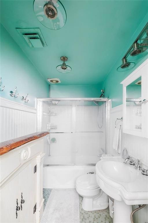 full bathroom featuring sink, toilet, and shower / washtub combination