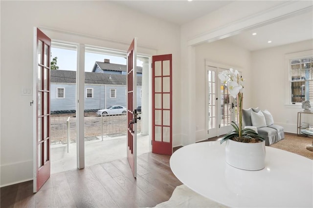 dining area featuring hardwood / wood-style flooring and french doors