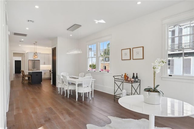 dining room with dark hardwood / wood-style flooring