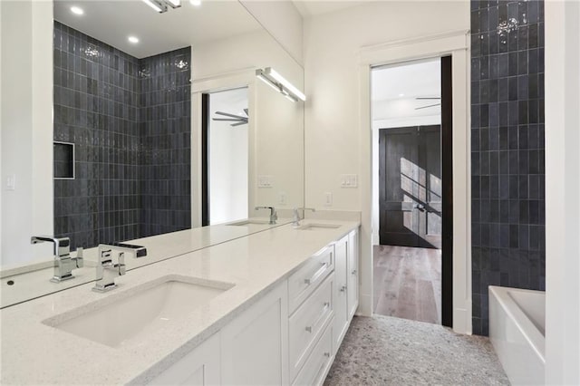 bathroom featuring vanity and washtub / shower combination