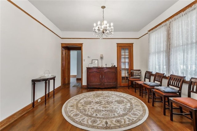 living area featuring dark hardwood / wood-style flooring and a notable chandelier