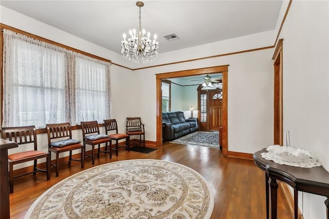 sitting room featuring ceiling fan with notable chandelier and dark hardwood / wood-style floors