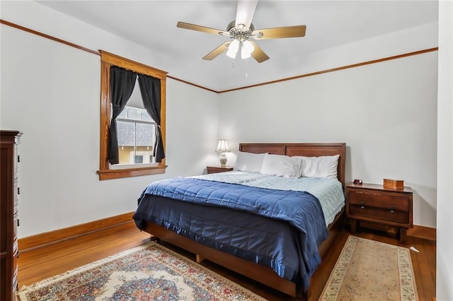 bedroom featuring ceiling fan and hardwood / wood-style floors