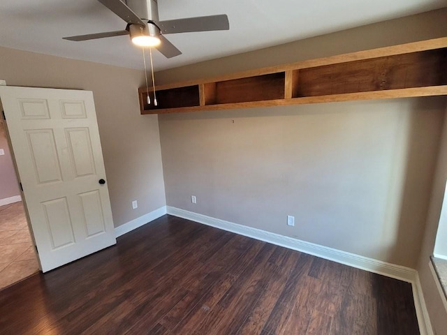 interior space with ceiling fan and dark hardwood / wood-style flooring