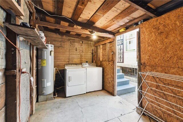 laundry room with independent washer and dryer and water heater