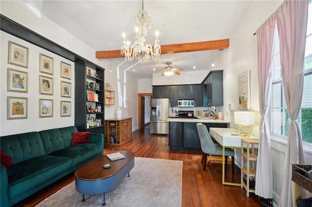 living room featuring beamed ceiling, dark hardwood / wood-style floors, and ceiling fan with notable chandelier