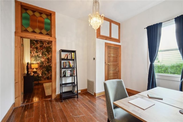 home office featuring dark hardwood / wood-style floors and a notable chandelier