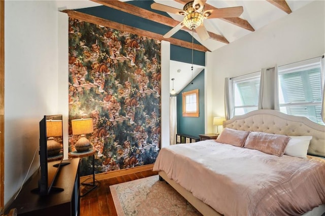 bedroom featuring dark hardwood / wood-style floors and vaulted ceiling with beams