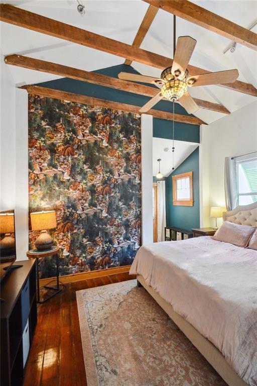 bedroom featuring dark wood-type flooring and vaulted ceiling with beams