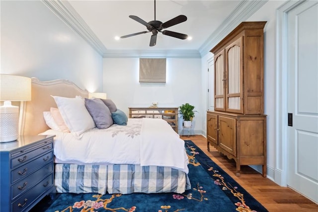 bedroom with wood-type flooring, ceiling fan, and ornamental molding