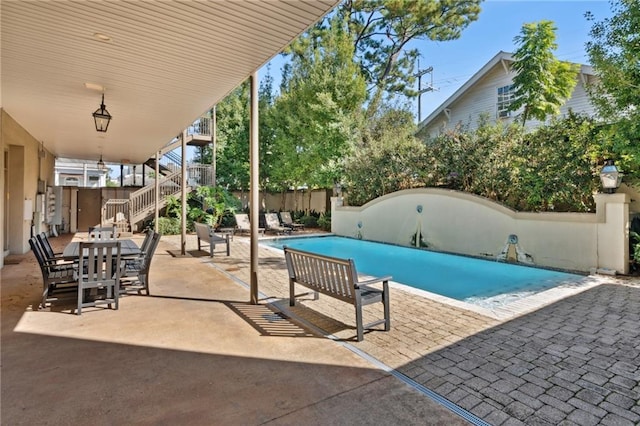 view of swimming pool featuring a patio