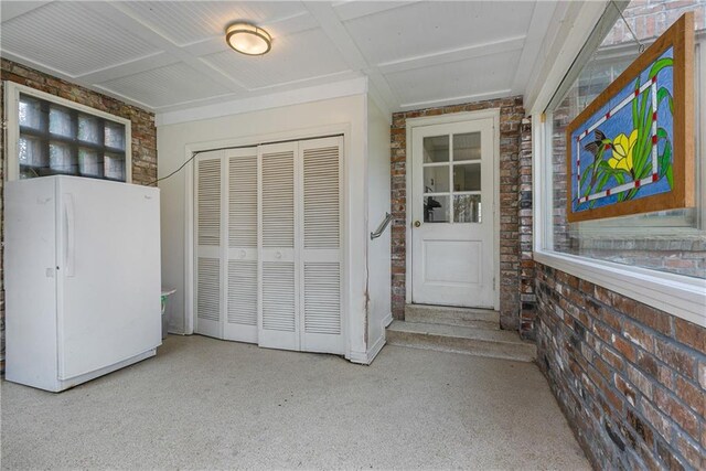 living room featuring dark hardwood / wood-style flooring, crown molding, and a healthy amount of sunlight