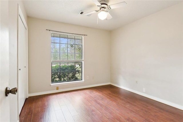 spare room featuring ceiling fan and hardwood / wood-style flooring