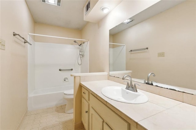 full bathroom featuring tile patterned flooring, bathtub / shower combination, vanity, and toilet