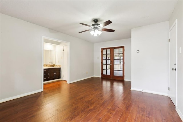 unfurnished room featuring ceiling fan, dark wood-type flooring, and french doors