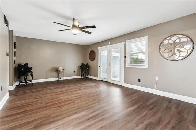 interior space with ceiling fan and dark hardwood / wood-style flooring