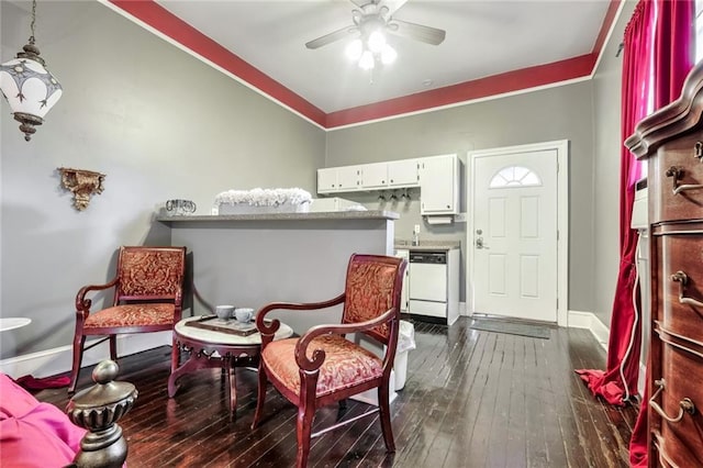 sitting room featuring dark hardwood / wood-style floors and ceiling fan