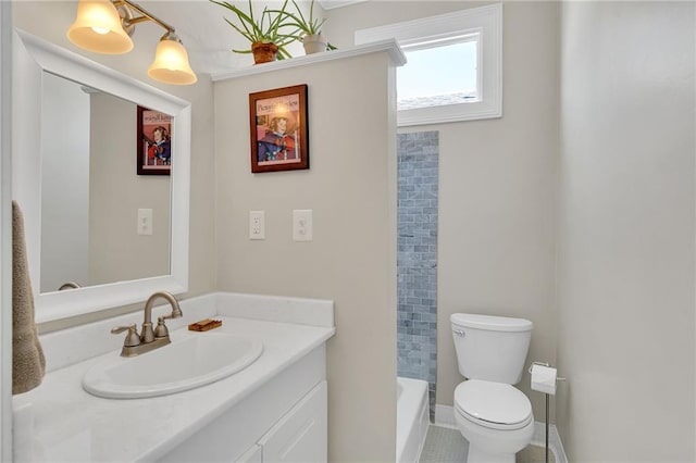 bathroom with vanity, a tub to relax in, and toilet