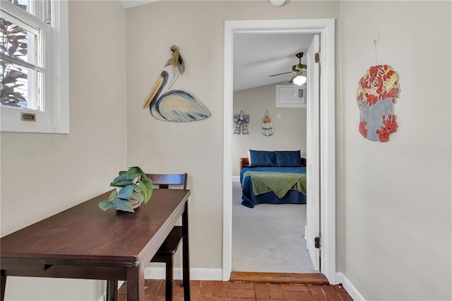 hallway featuring lofted ceiling