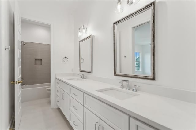 full bathroom with vanity, shower / bathtub combination, and toilet