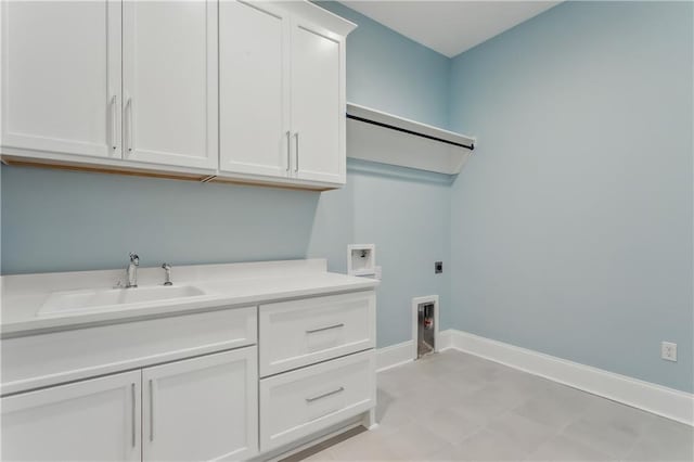 laundry room featuring hookup for a washing machine, sink, cabinets, and hookup for an electric dryer