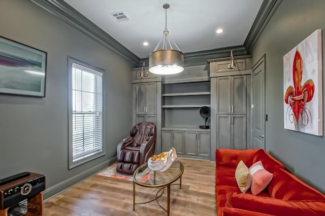 living area featuring visible vents, crown molding, wood finished floors, and recessed lighting